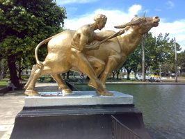; Sculpture of Man and Water Buffalo Capitol Lagoon Bacolod City Philippines