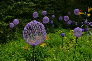 03 garden-sculptures-flowerbed-spheres-wire-grapevines-bucket-decor-vegetables-flowers-backyard