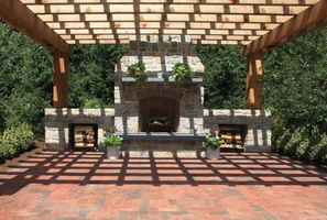 cool-white-stoned-outdoor-fireplace-with-decorative-plants-also-wooden-pergola-canopy-design