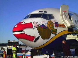 ; 0  funny-christmas-photos-santa-on-the-nose-of-a-plane